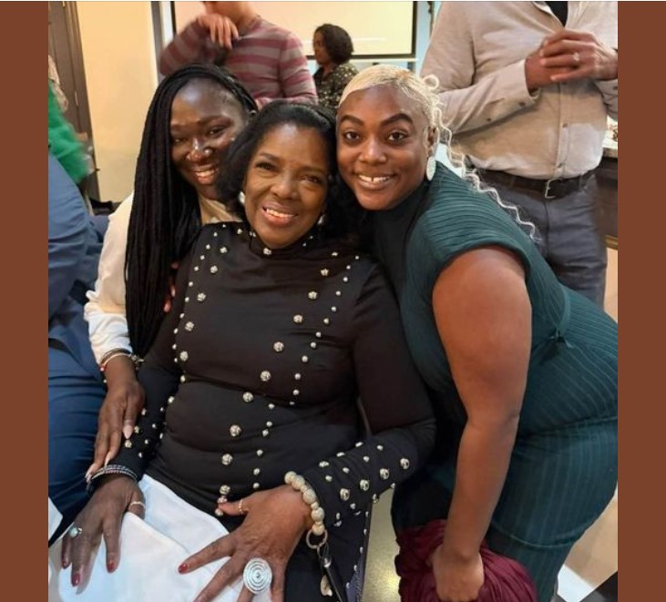 Photo of two alumni hugging Dr. La Verne Reid at her retirement celebration