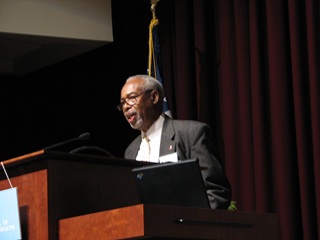 Photo of Bill Small speaking in 2009