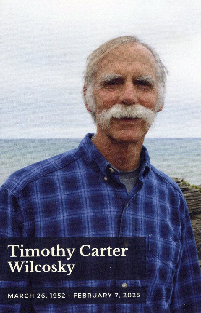 Photo of Tim Wilcosky on the cover of the program from his memorial celebration