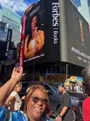 Photo of Victoria Washington below the billboard for her
daughter Ella's new book Unspoken